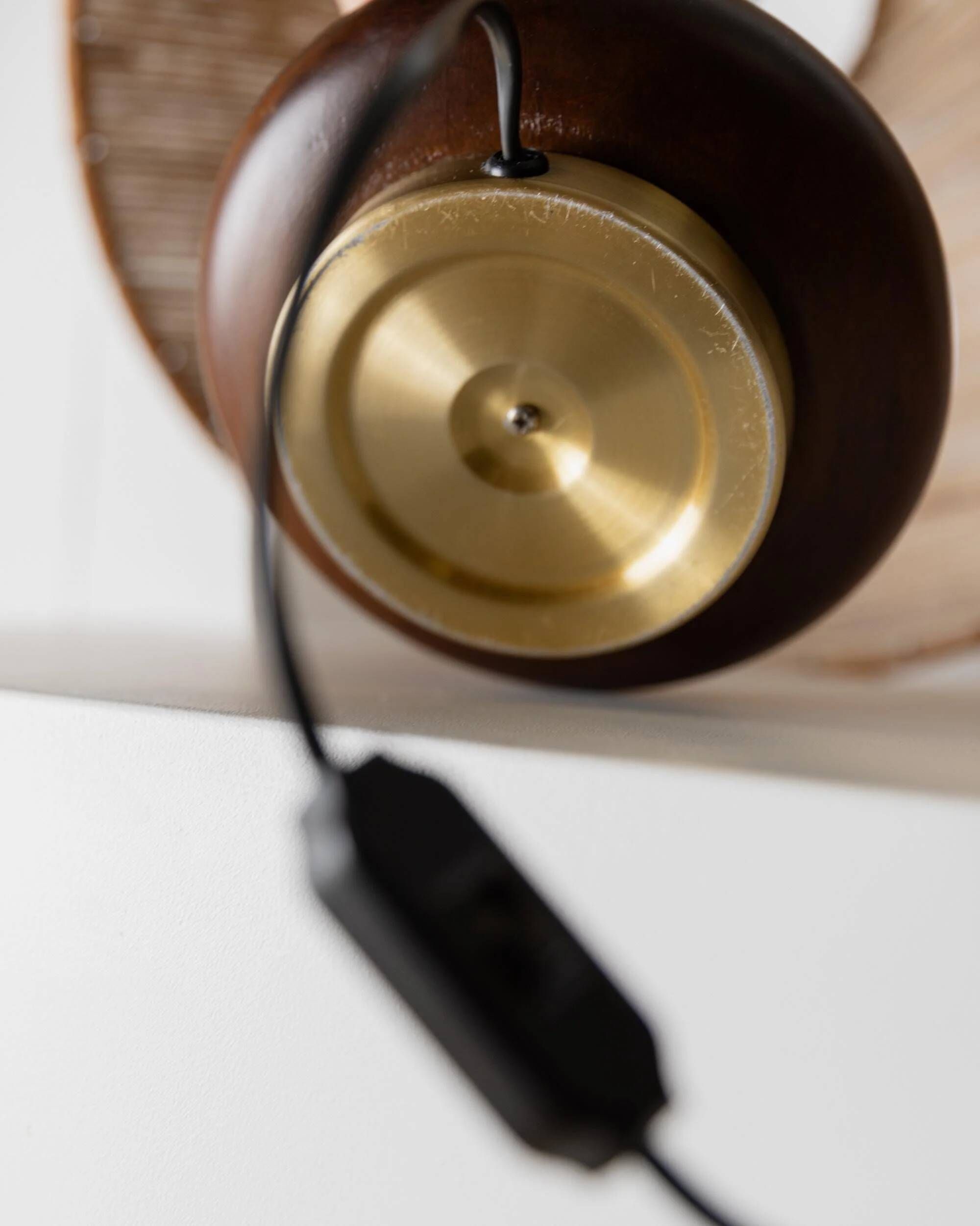 Lot of 2 vintage table lamps from the 1970s, dark wood oval bases with curved brass details, handmade natural fibre lampshades, elegant lighting.