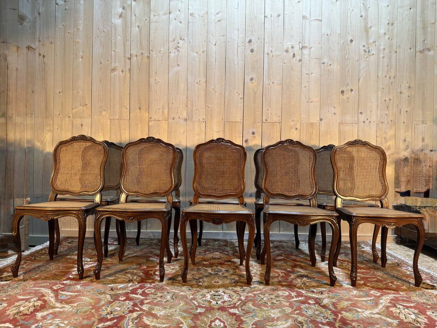 Set of 10 Louis XV style chairs in walnut and cane.