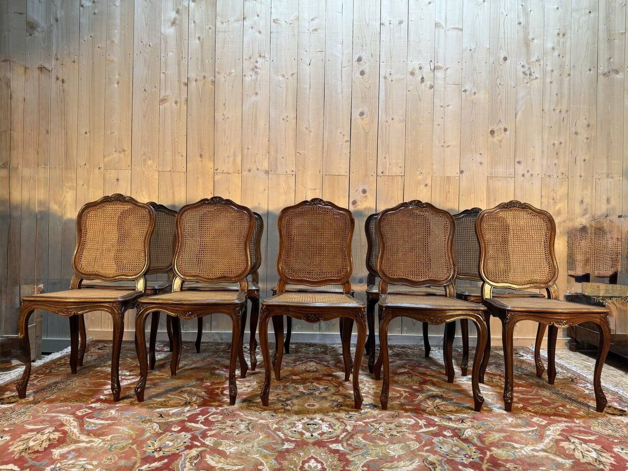 Set of 10 Louis XV style chairs in walnut and cane.