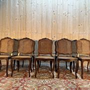 Set of 10 Louis XV style chairs in walnut and cane.