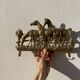 Hook for keys or tea towels in gilded brass with carved horse decoration
