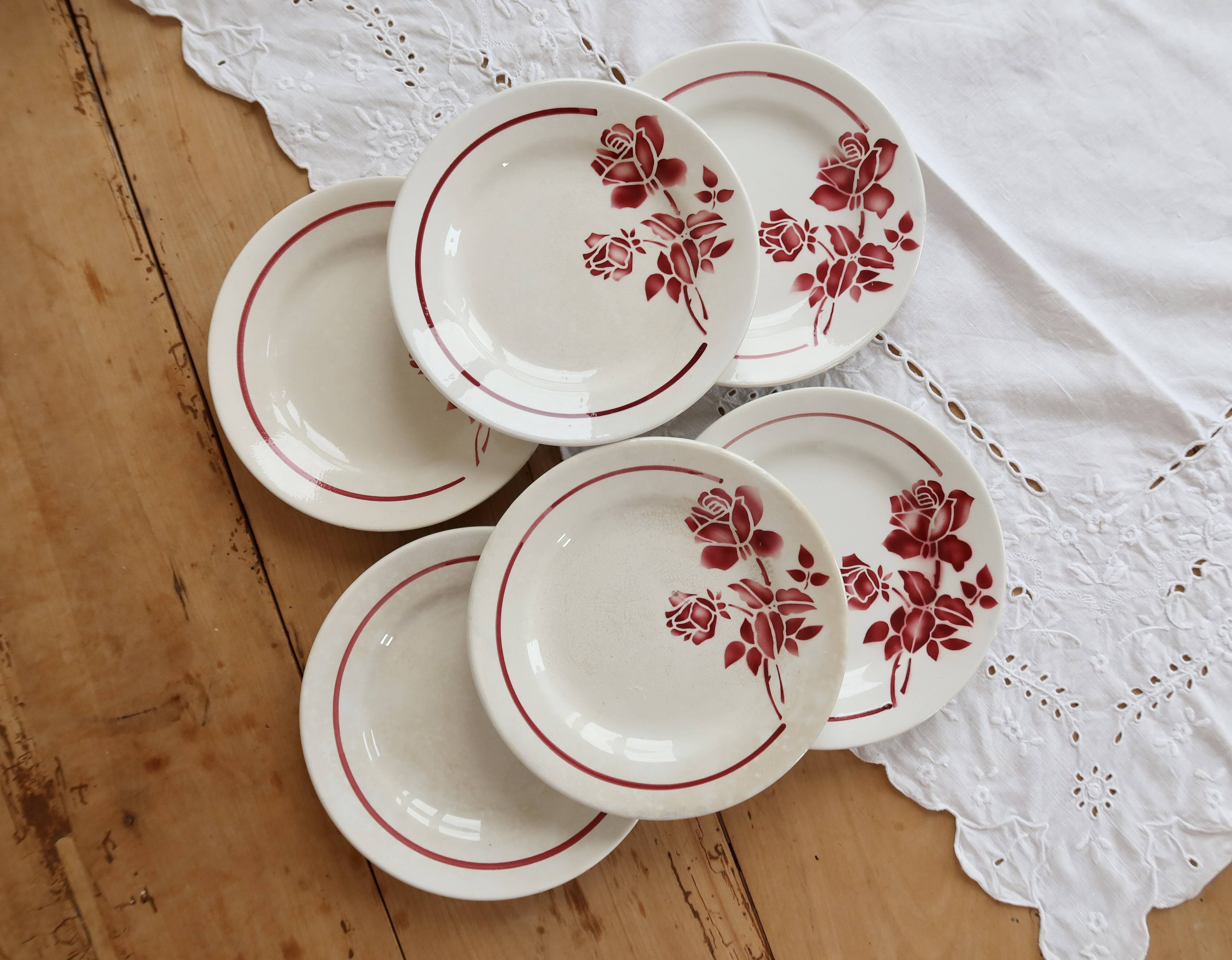 6 vintage dessert plates Moulin des Loups with burgundy floral decoration.