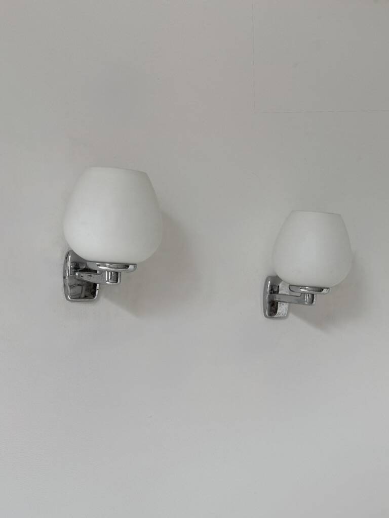 Pair of vintage opaline and chrome metal wall lights, France, 1970.