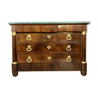Empire mahogany dresser with enlisted columns surrounded by gilded bronze rings
