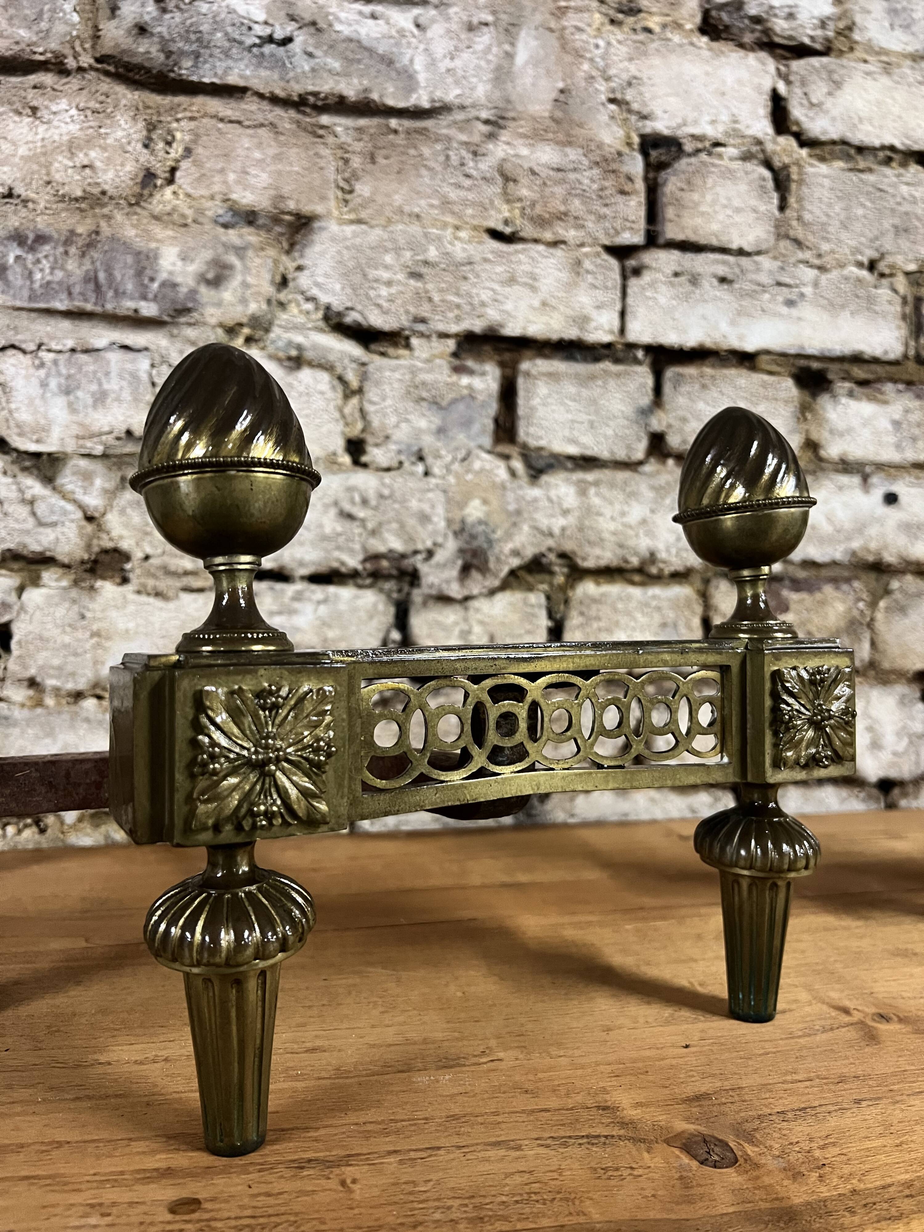 Pair of bronze andirons stamped bouhon frères in louis xvi style