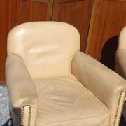 Pair of 1930s club armchairs in ivory leather.