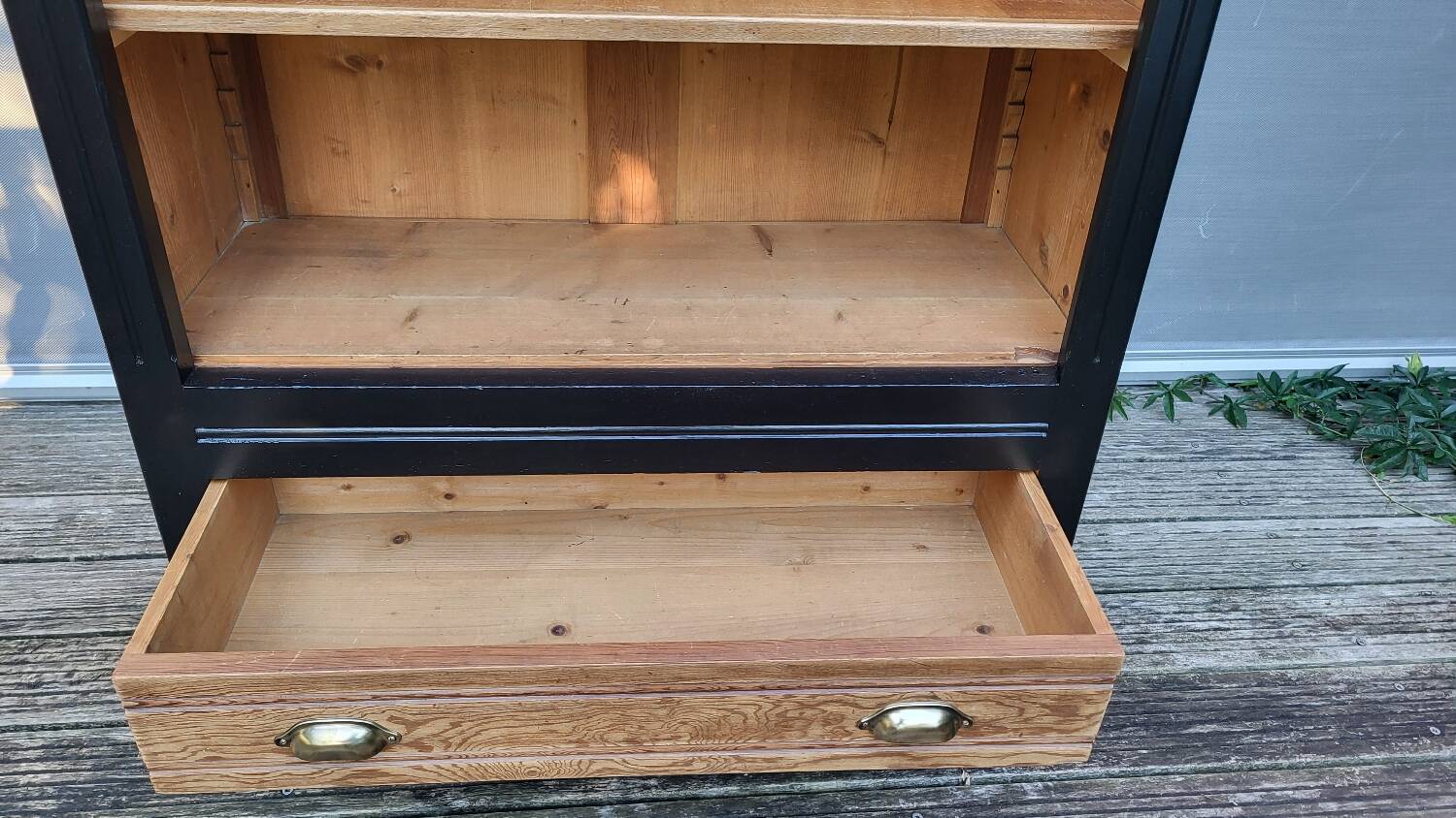 Two-tone black and honey bookcase
