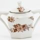 Lot teapot and sugar flowers in ancient ceramic