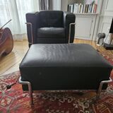 Leather armchair and pouffe
