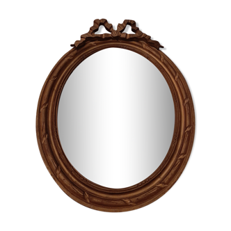 Miroir médaillon bois sculpté doré - 48x38cm