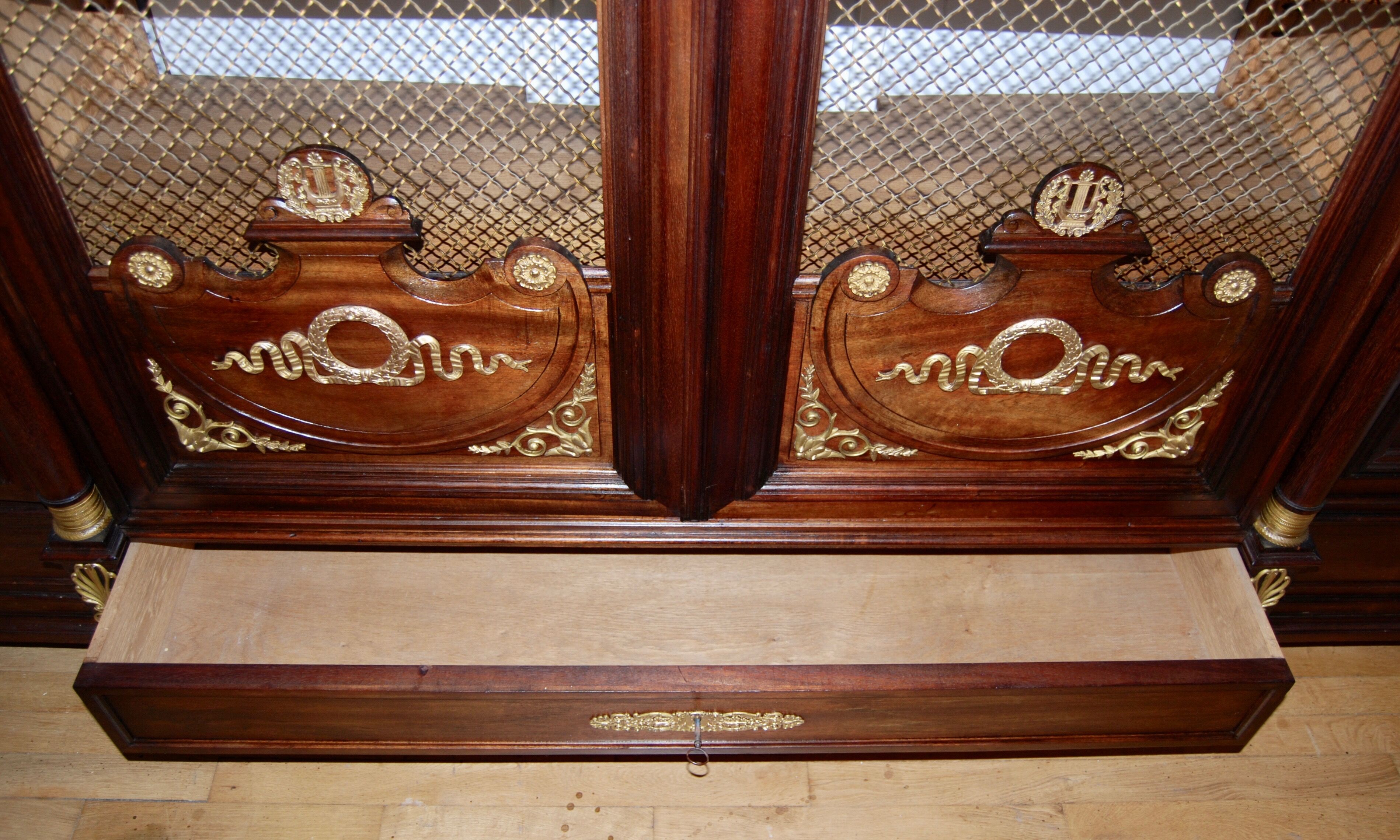 Large Empire library in solid mahogany, late nineteenth century