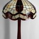 Art Deco floor lamp in carved walnut, stained glass shade, France, c. 1920