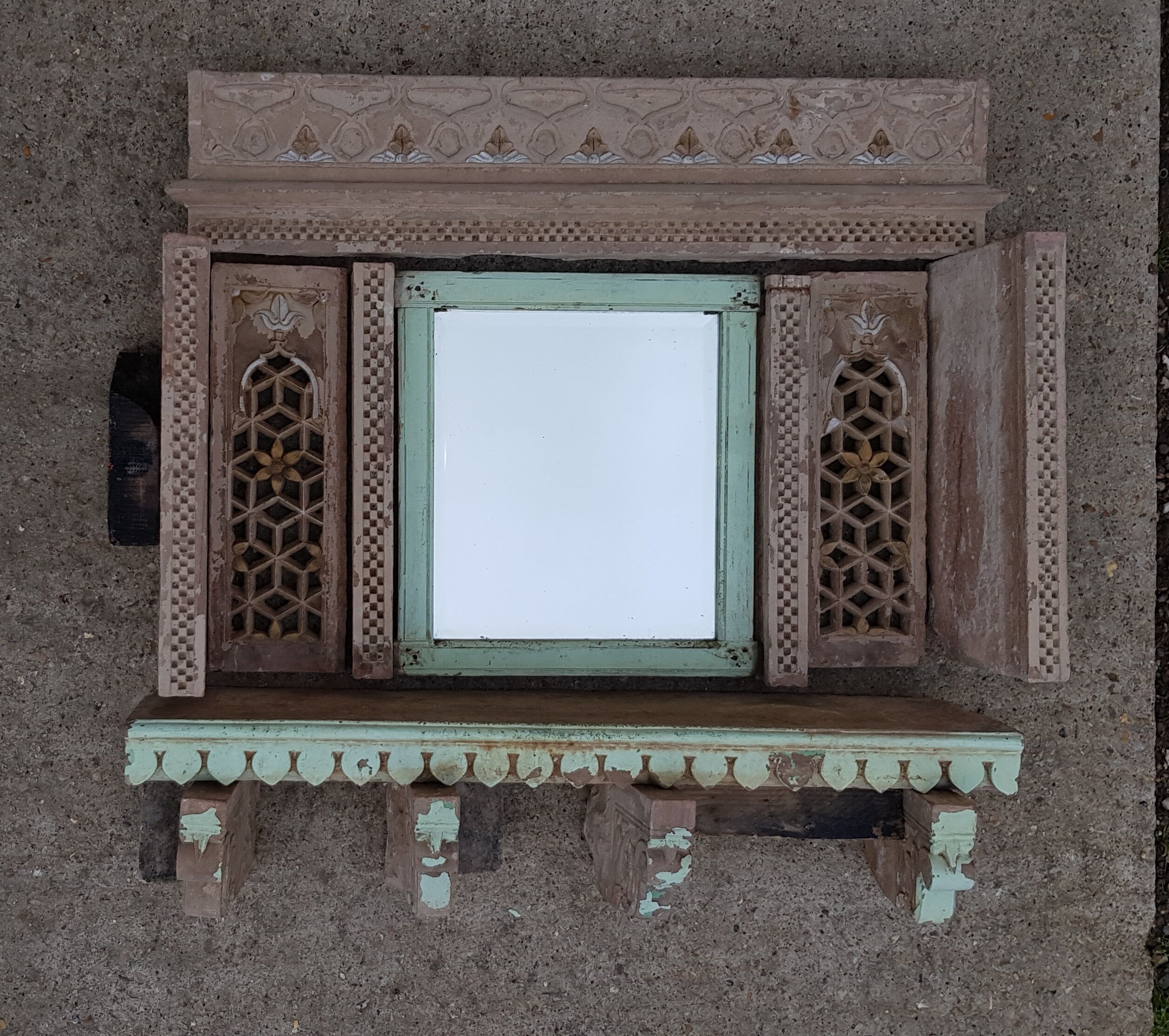 Fully hand-carved stone window with mirror