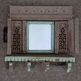 Fully hand-carved stone window with mirror