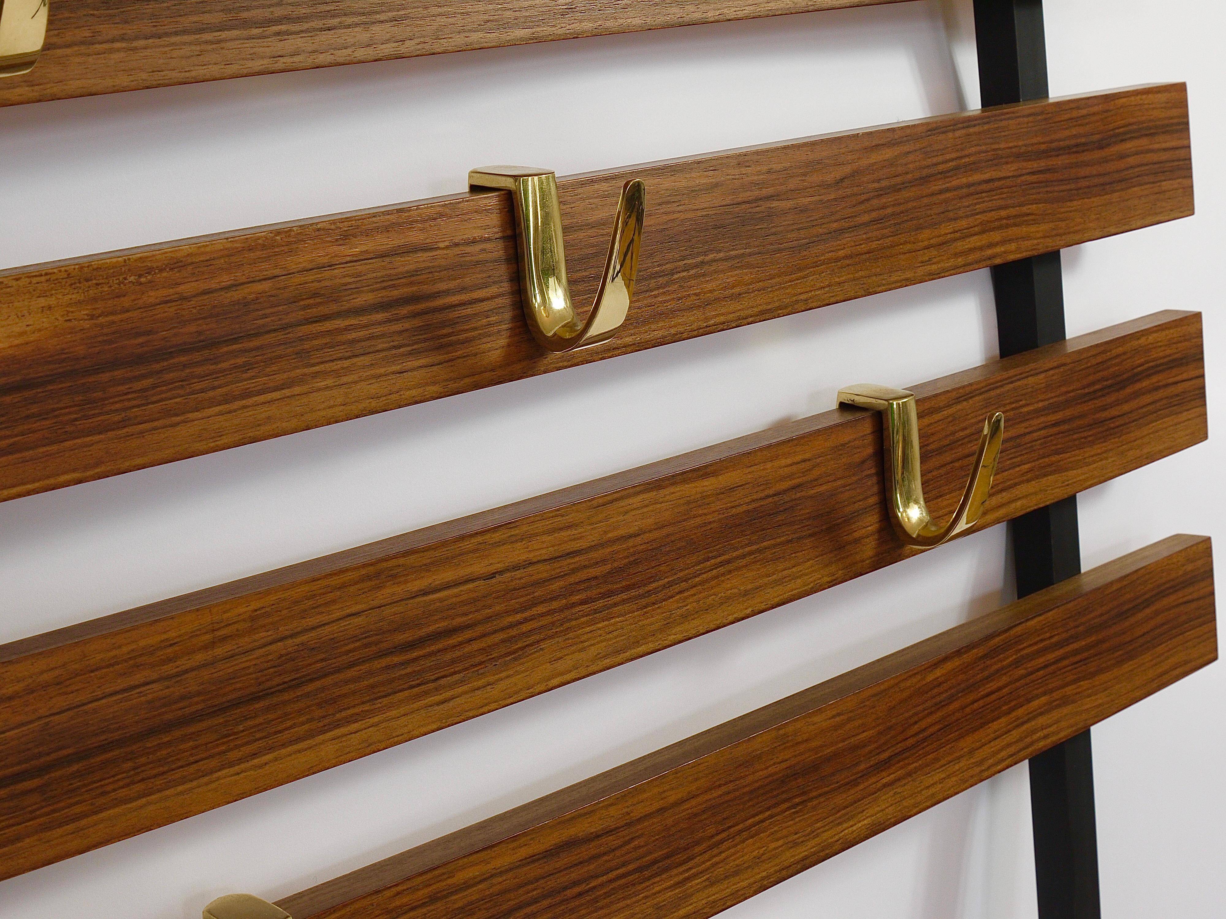 Wall coat rack by Carl Aubock with 5 brass hooks, walnut, iron, Austria, 1950s.