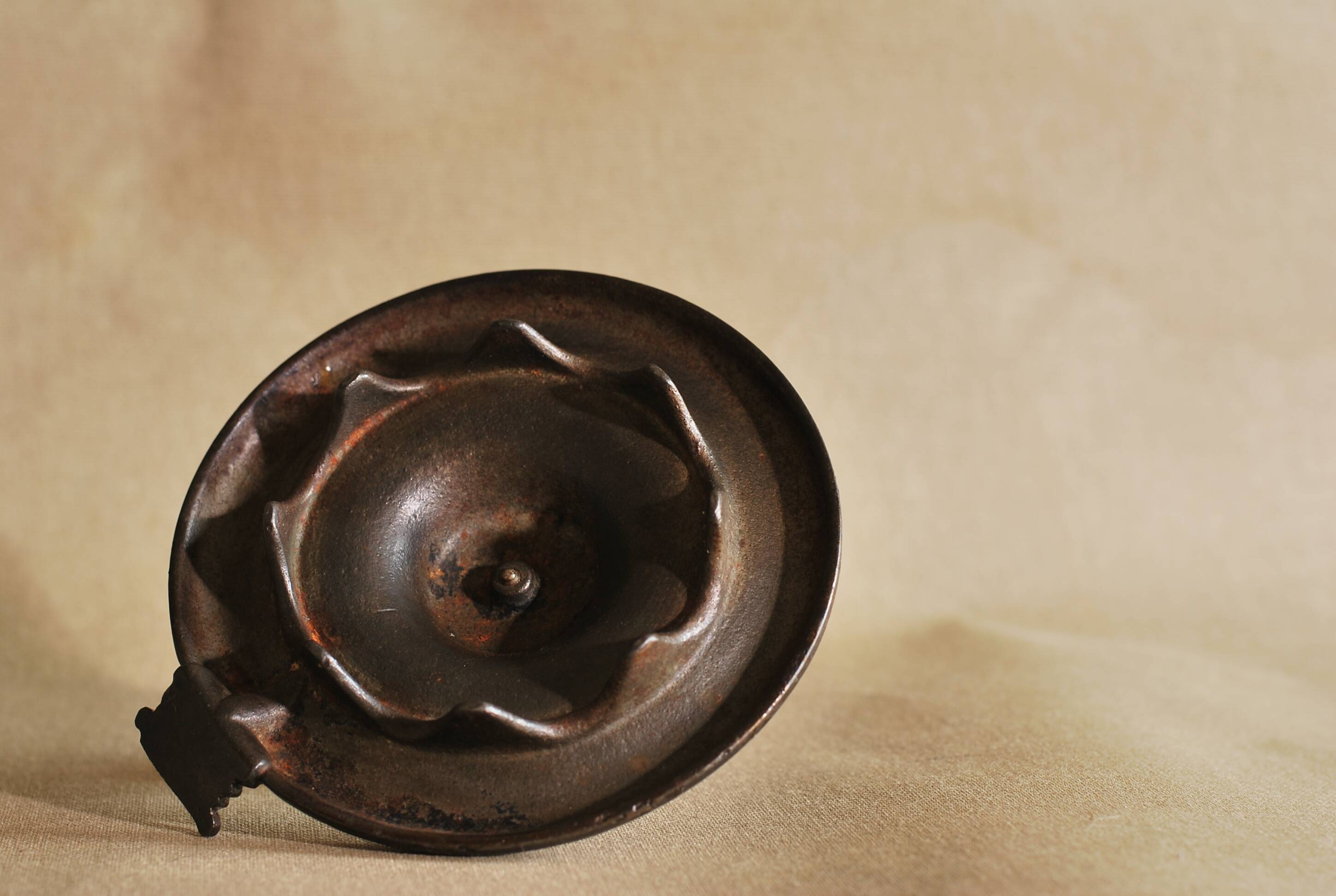 Bronze cellar rat hand candle holder