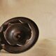 Bronze cellar rat hand candle holder