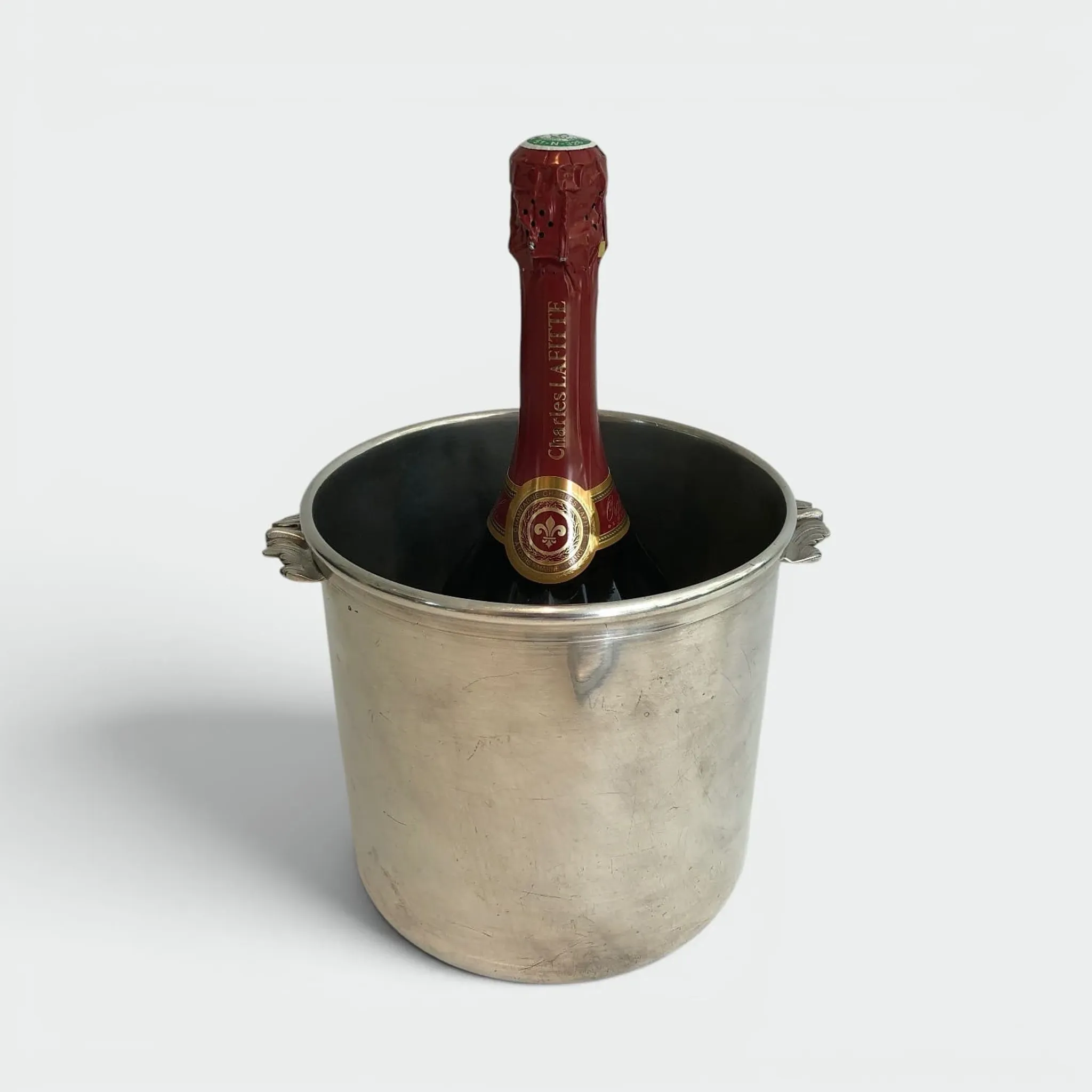 Cylindrical Silver-Plated Champagne Bucket with Small Leaf-Shaped Handles.