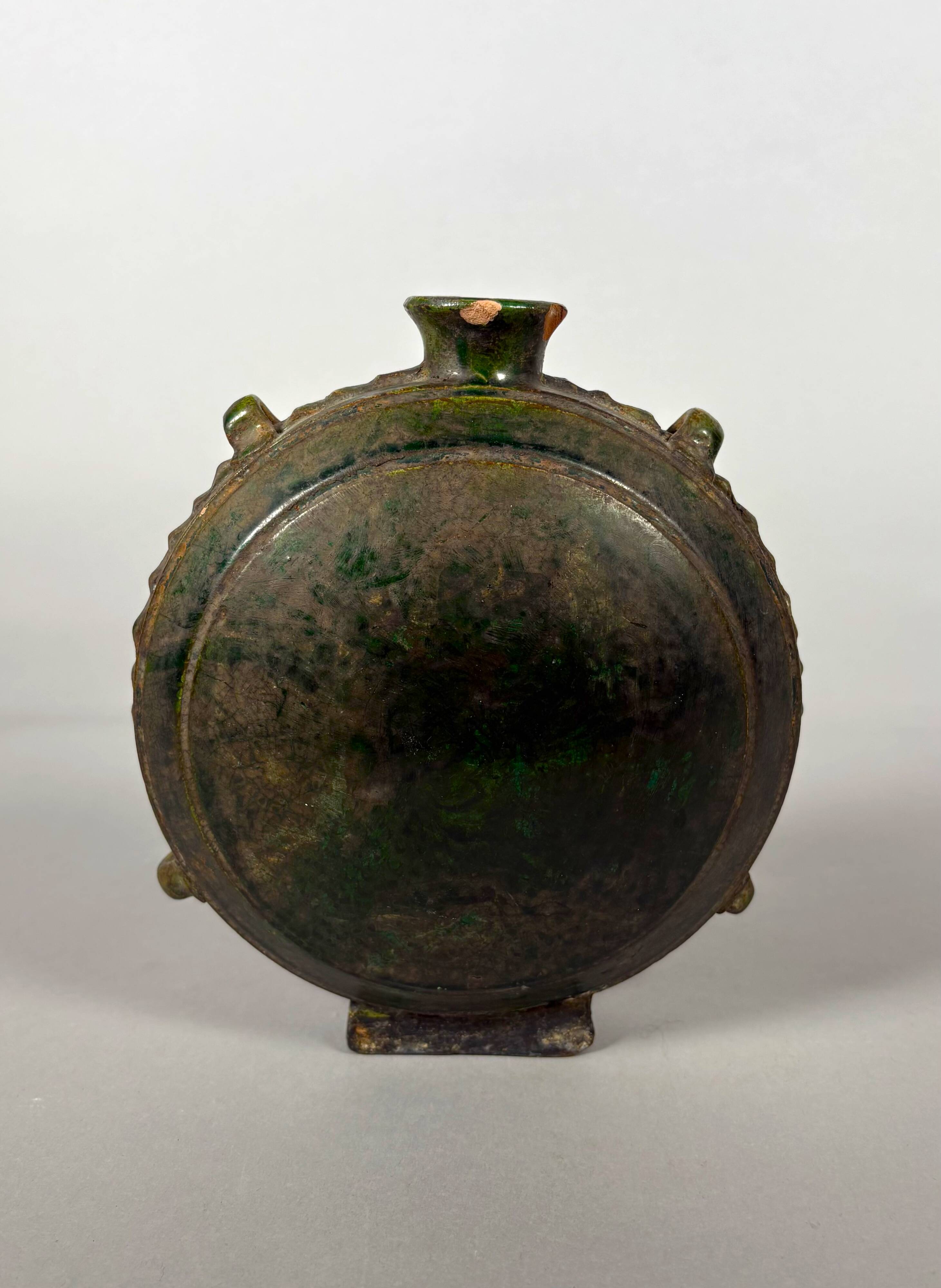 Nomadic rider's jug in green glazed earthenware, China, Tang Dynasty.