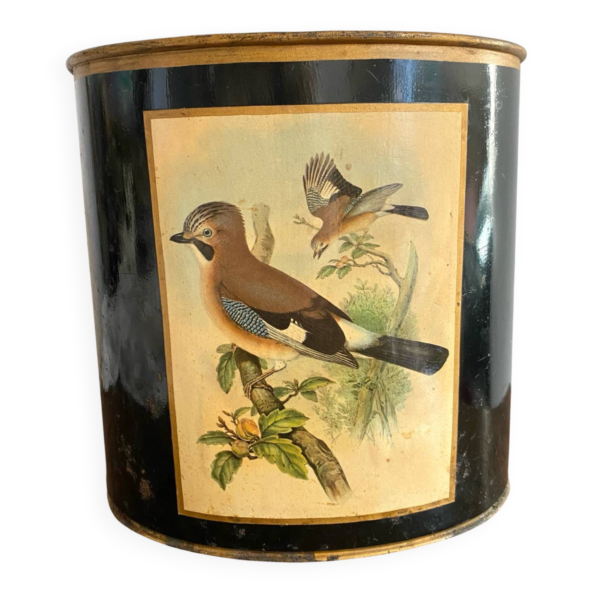 Metal wastebasket with bird decoration