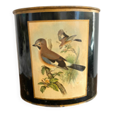 Metal wastebasket with bird decoration
