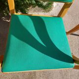 3 vintage bridge chairs with rounded armrests.