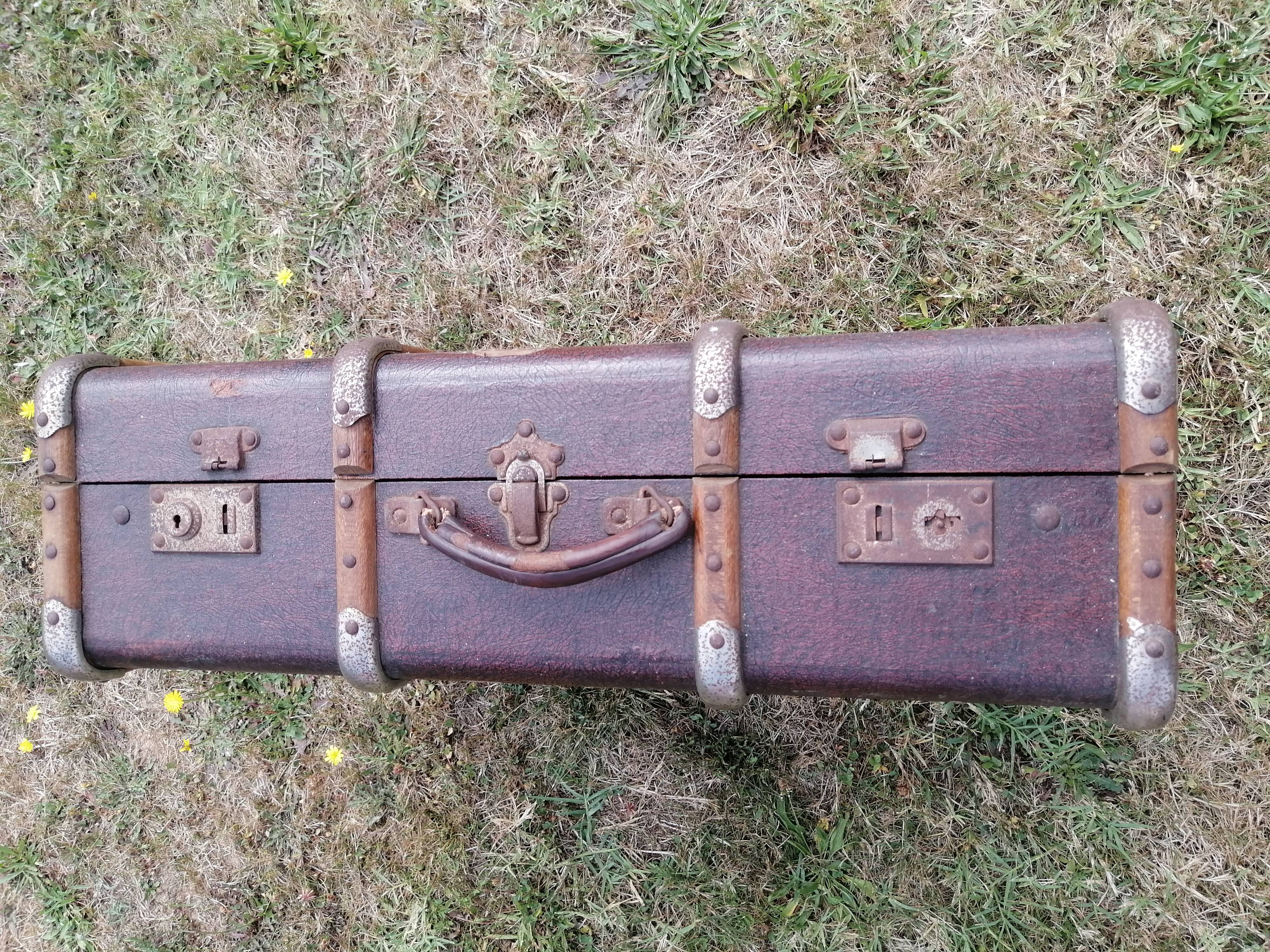 Antique suitcase in leather wood and vintage metal