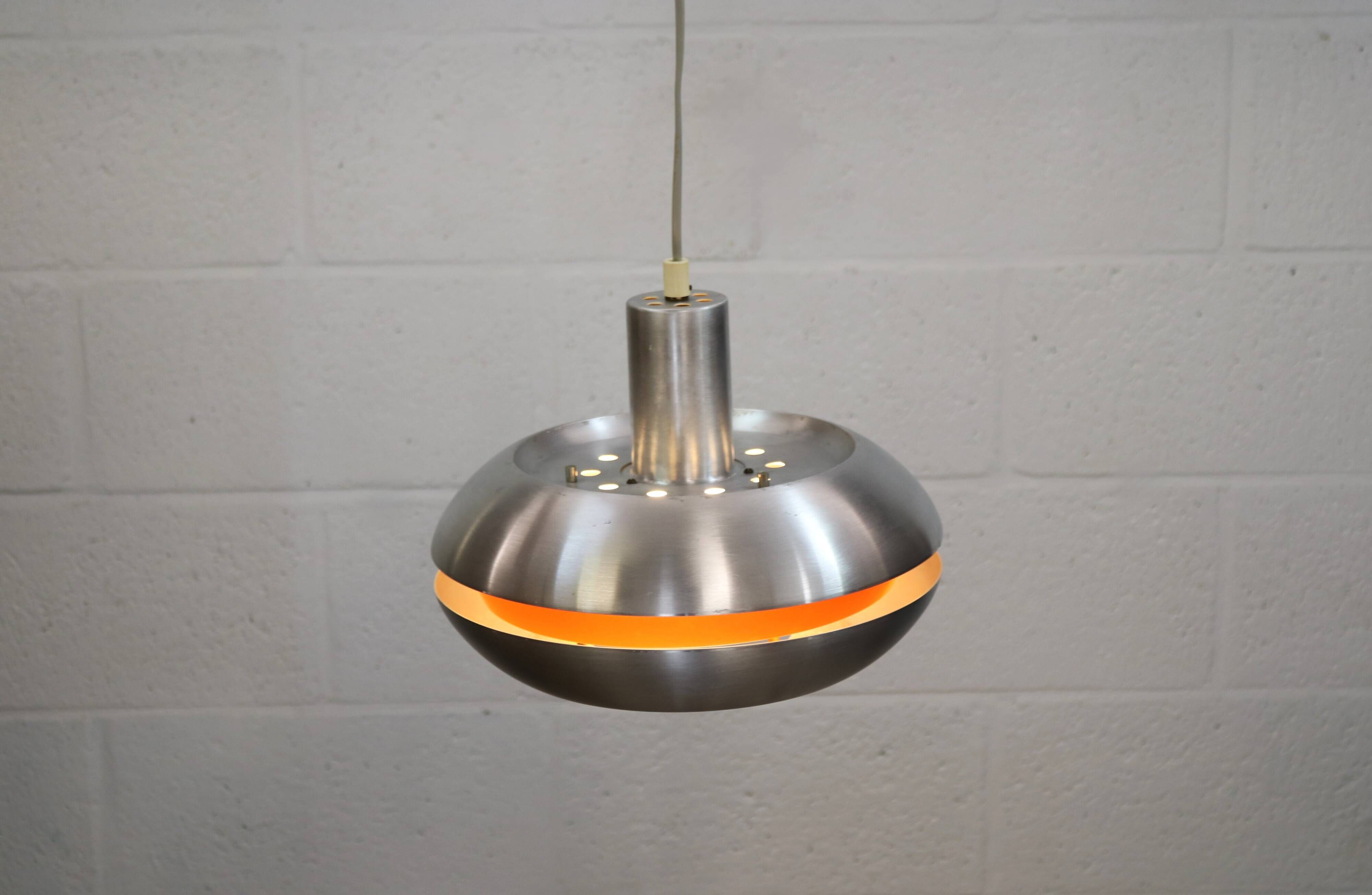 Old Danish space age design lamp in alu and orange inside.