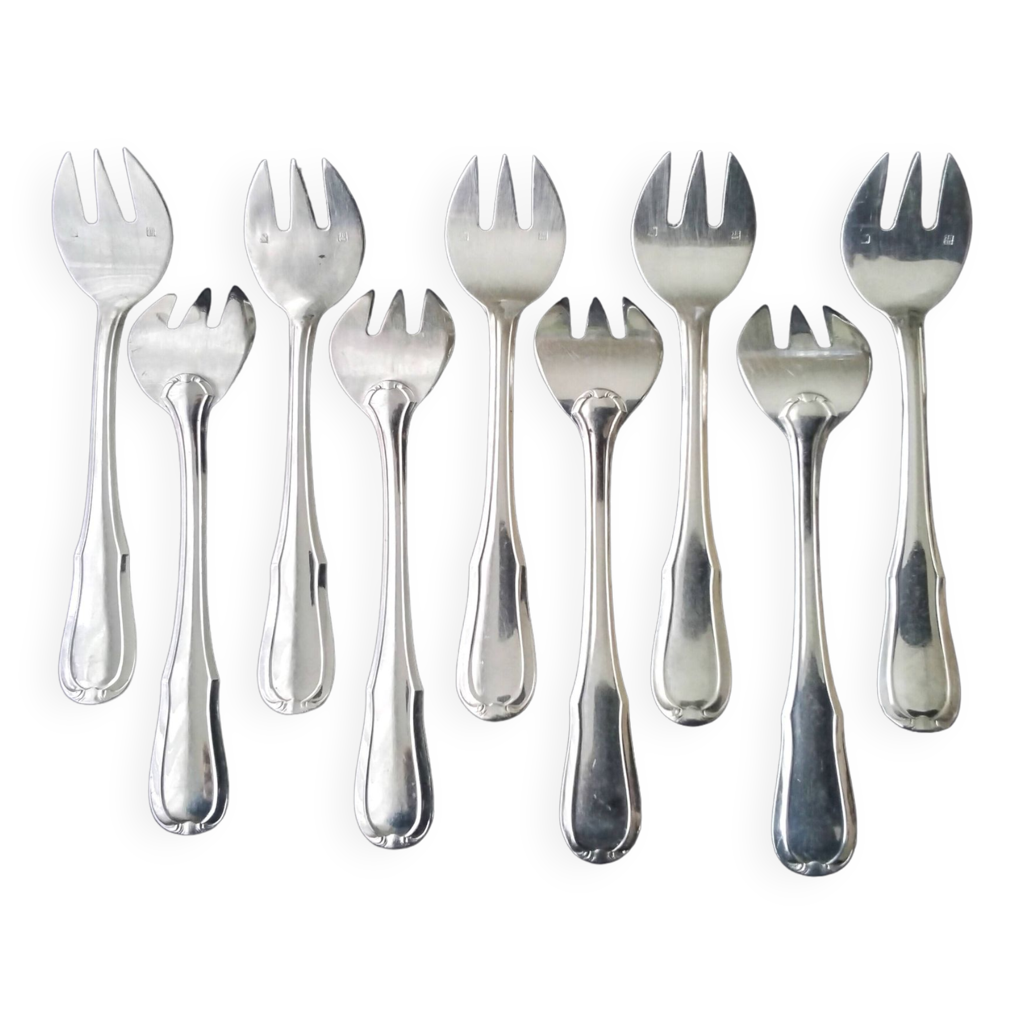 9 fourchettes à huitres en métal argenté
