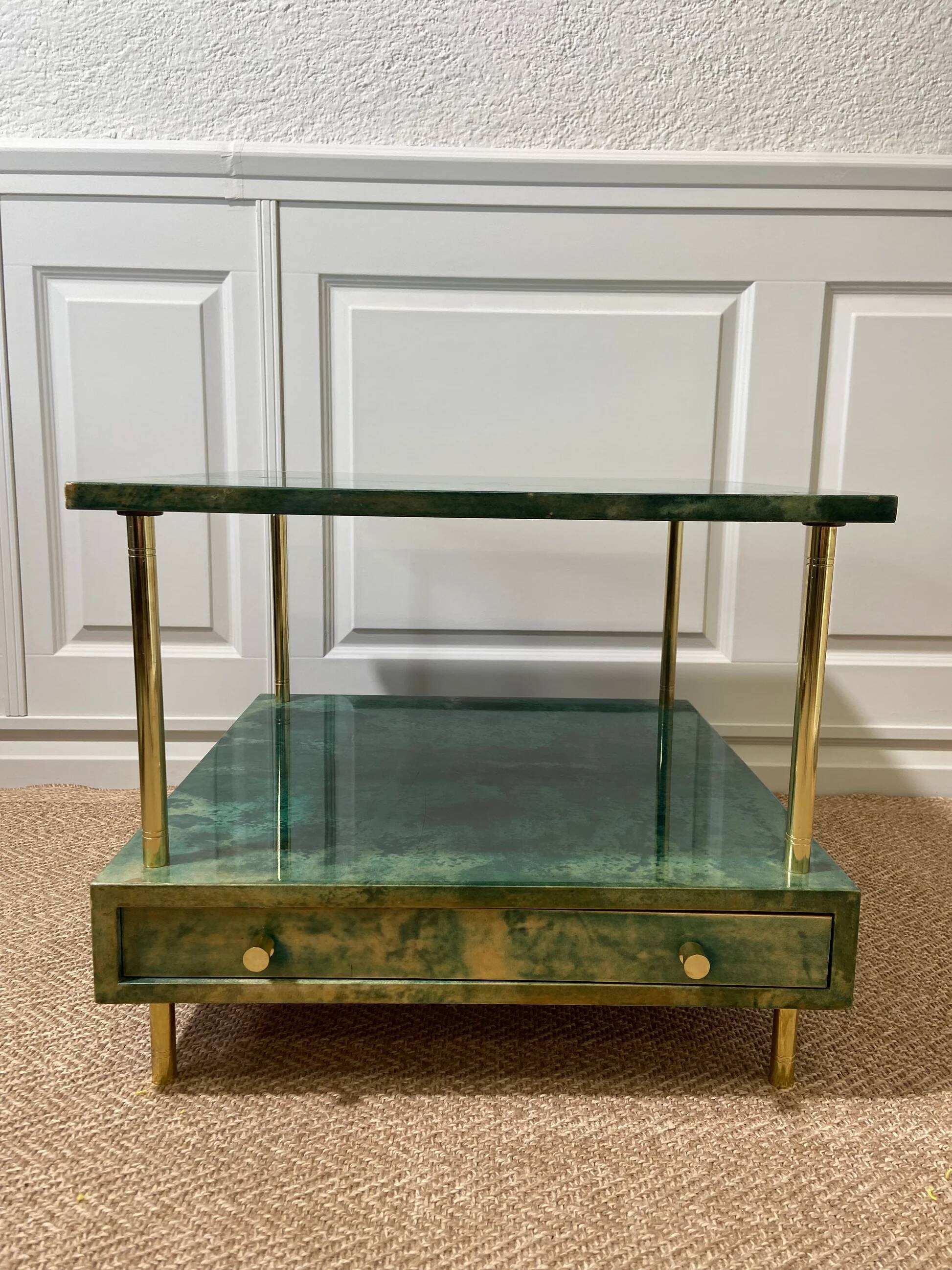 Aldo Tura side table in aqua green with brass legs and lower drawer.