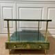 Aldo Tura side table in aqua green with brass legs and lower drawer.