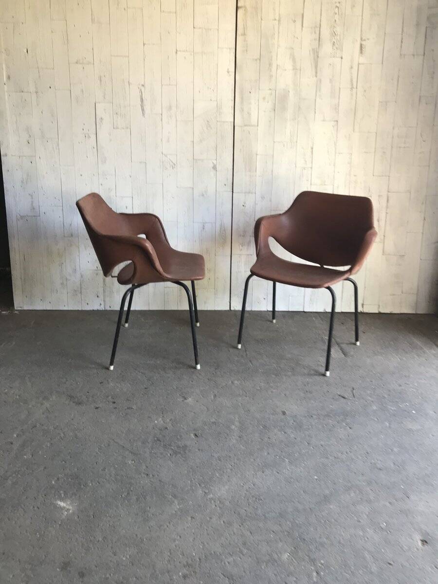 Set of 2 mid-century brown faux leather armchairs with black metal legs, 1960s.