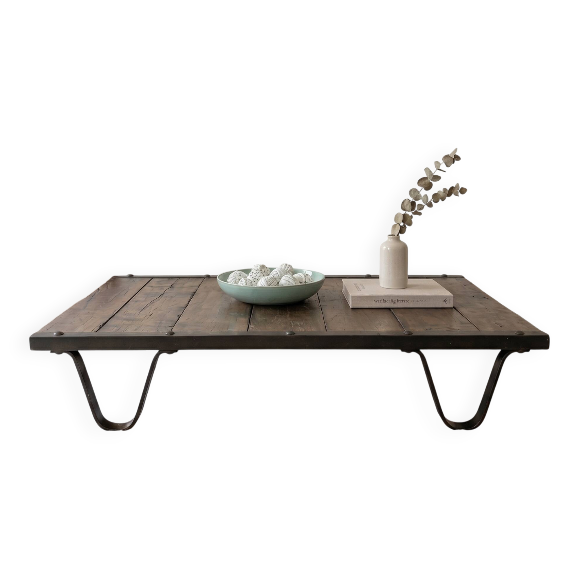 Industrial coffee table made of solid wood and old railway tracks.