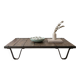Industrial coffee table made of solid wood and old railway tracks.