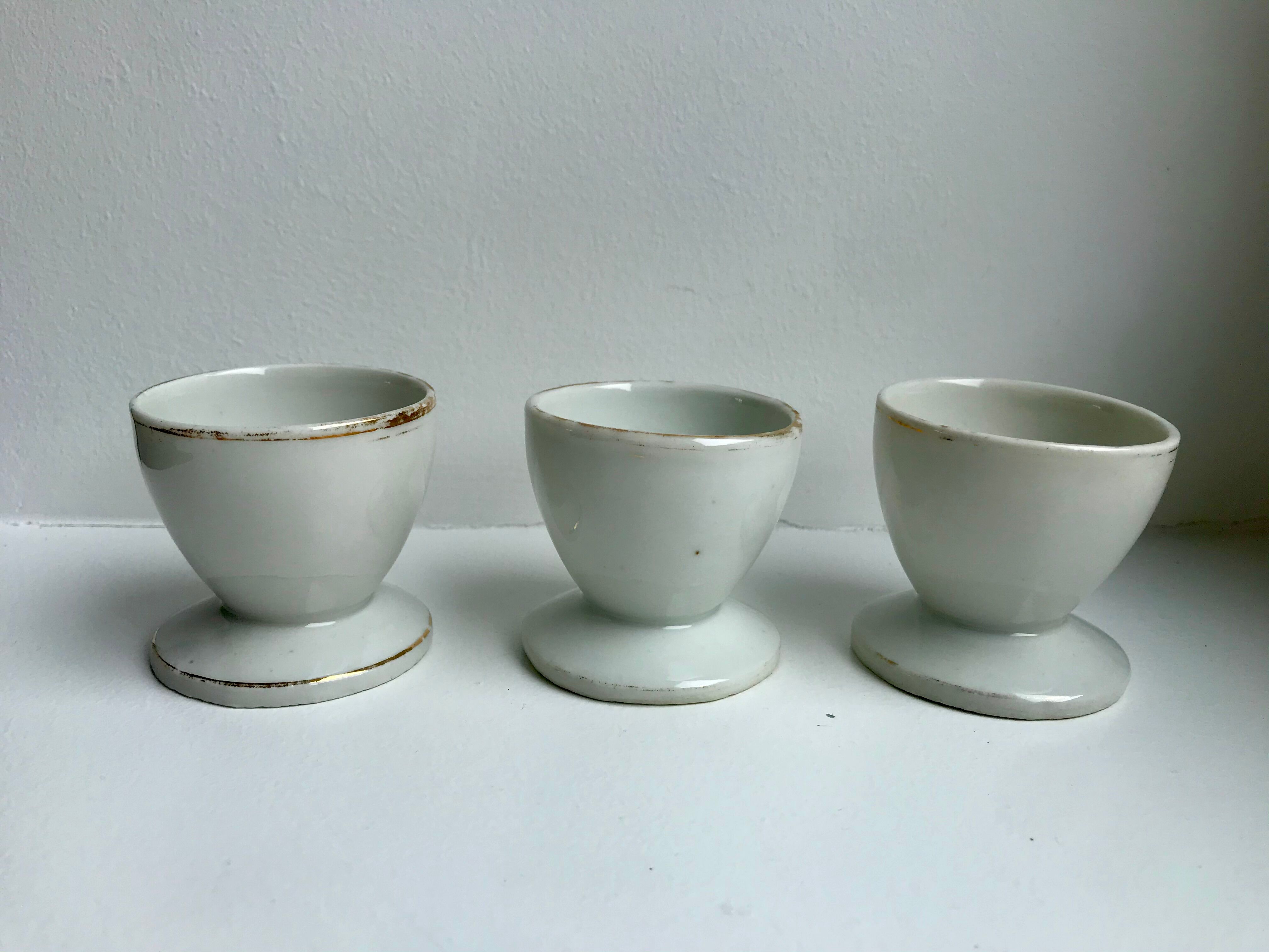 Trio of white shells bordered gold 50s