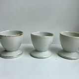 Trio of white shells bordered gold 50s