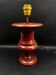 Lamp base in reconstituted stone, red "oxblood", 20th century