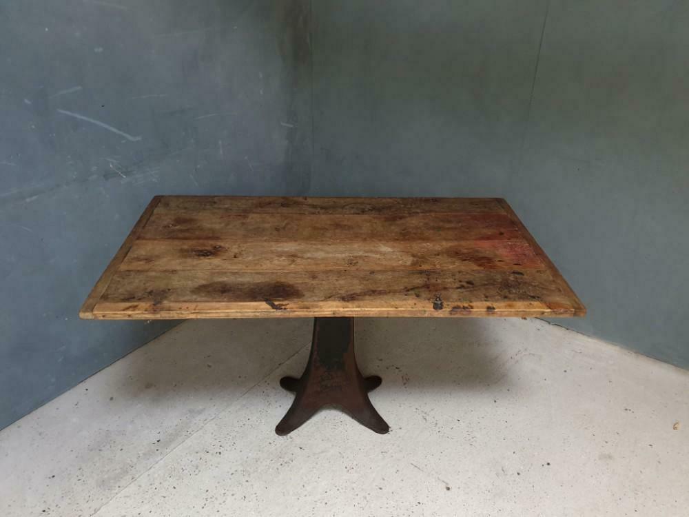 Old table on cast iron machine leg