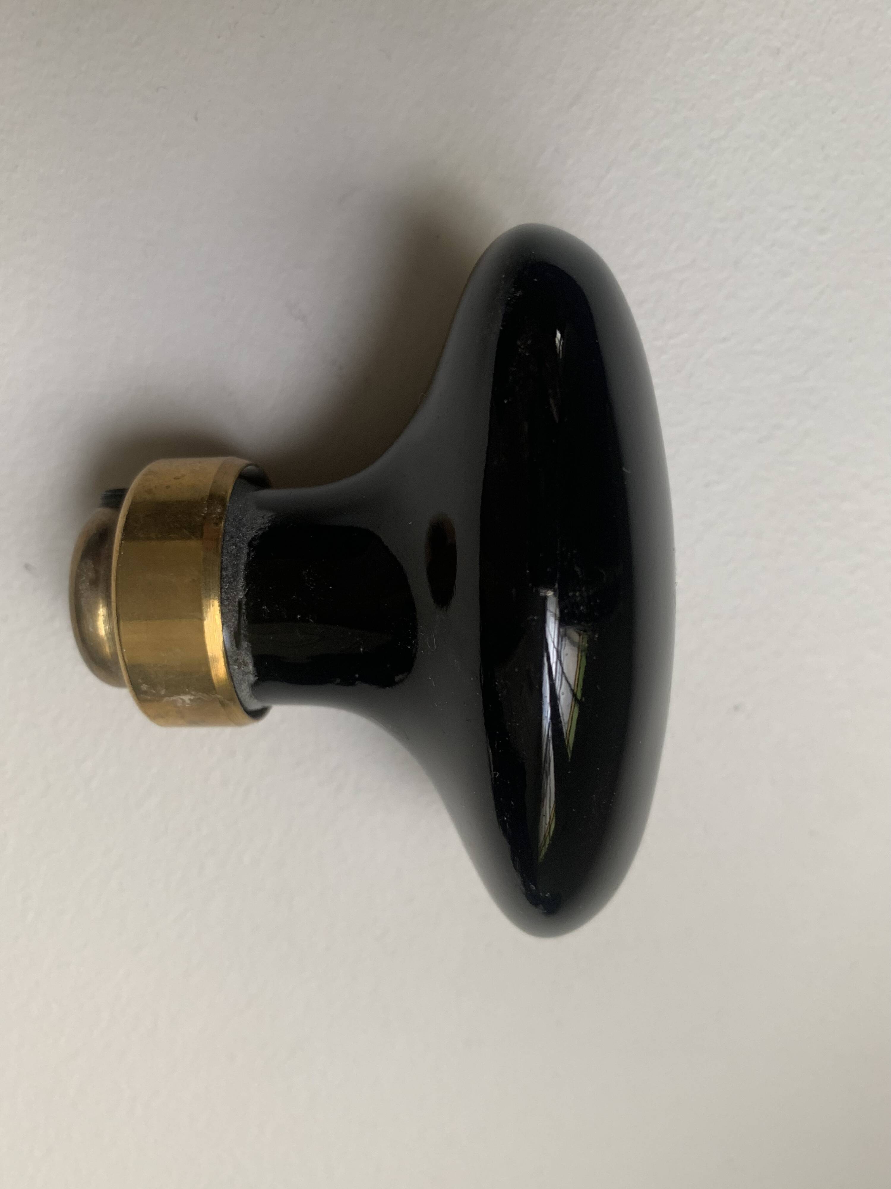 Black porcelain and brass handles