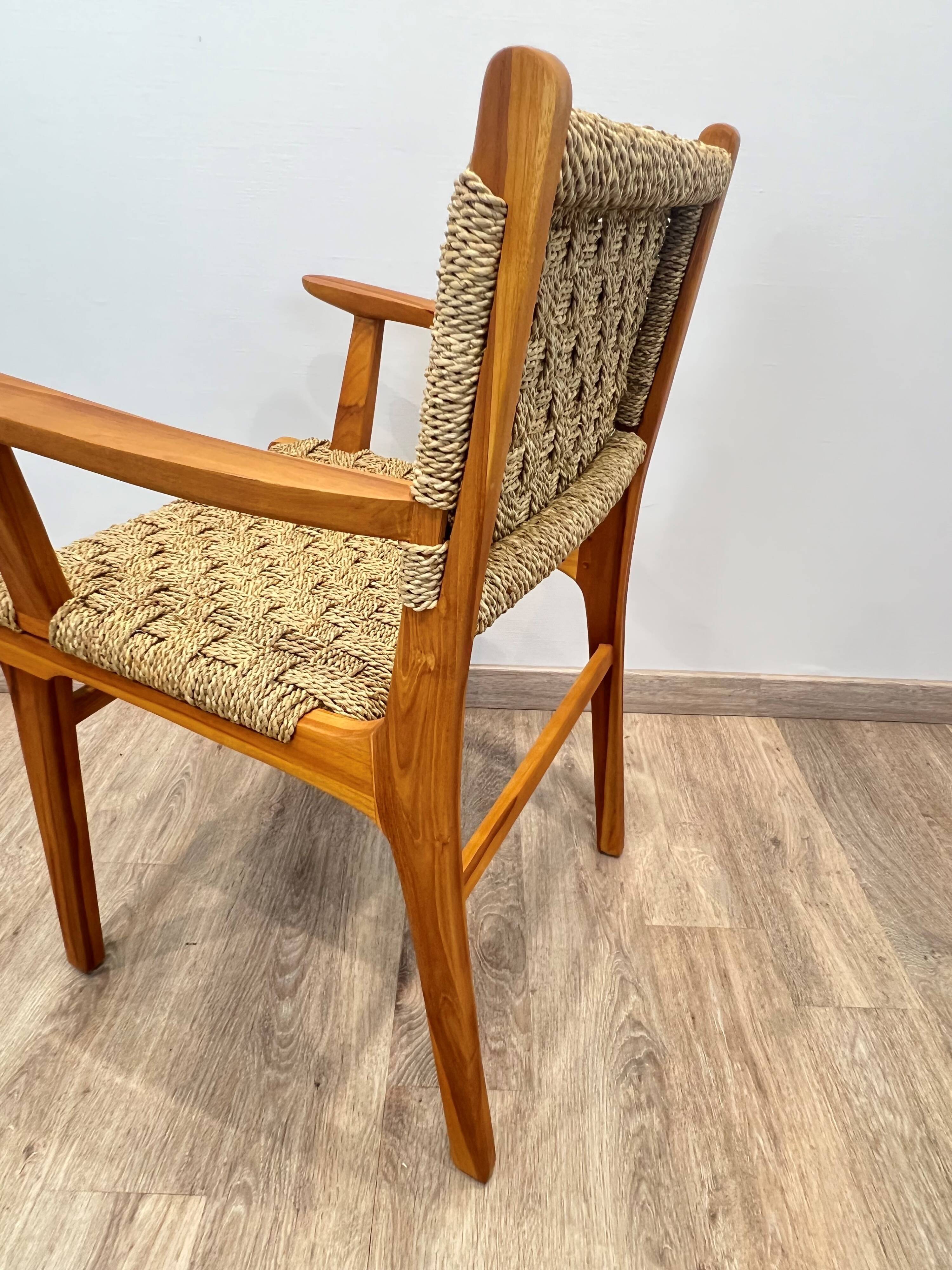 Pair of woven teak armchairs