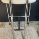 Vintage 70s chair in chrome metal and white faux leather.