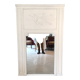 Fireplace trumeau mirror decorated with the attributes of music