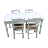 White farmhouse table set and four chairs