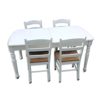 White farmhouse table set and four chairs