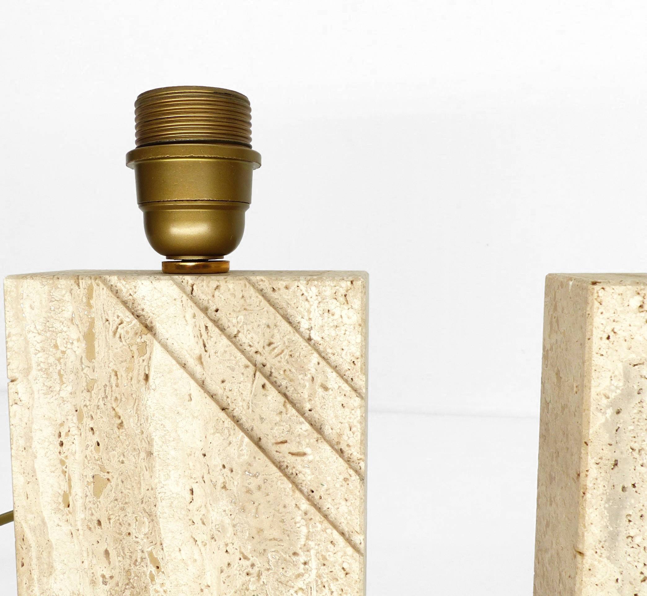 Pair of solid travertine table lamps with incised decoration, French production.