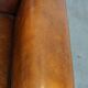 Sheepskin Art Deco design armchair with sleek finish and black piping