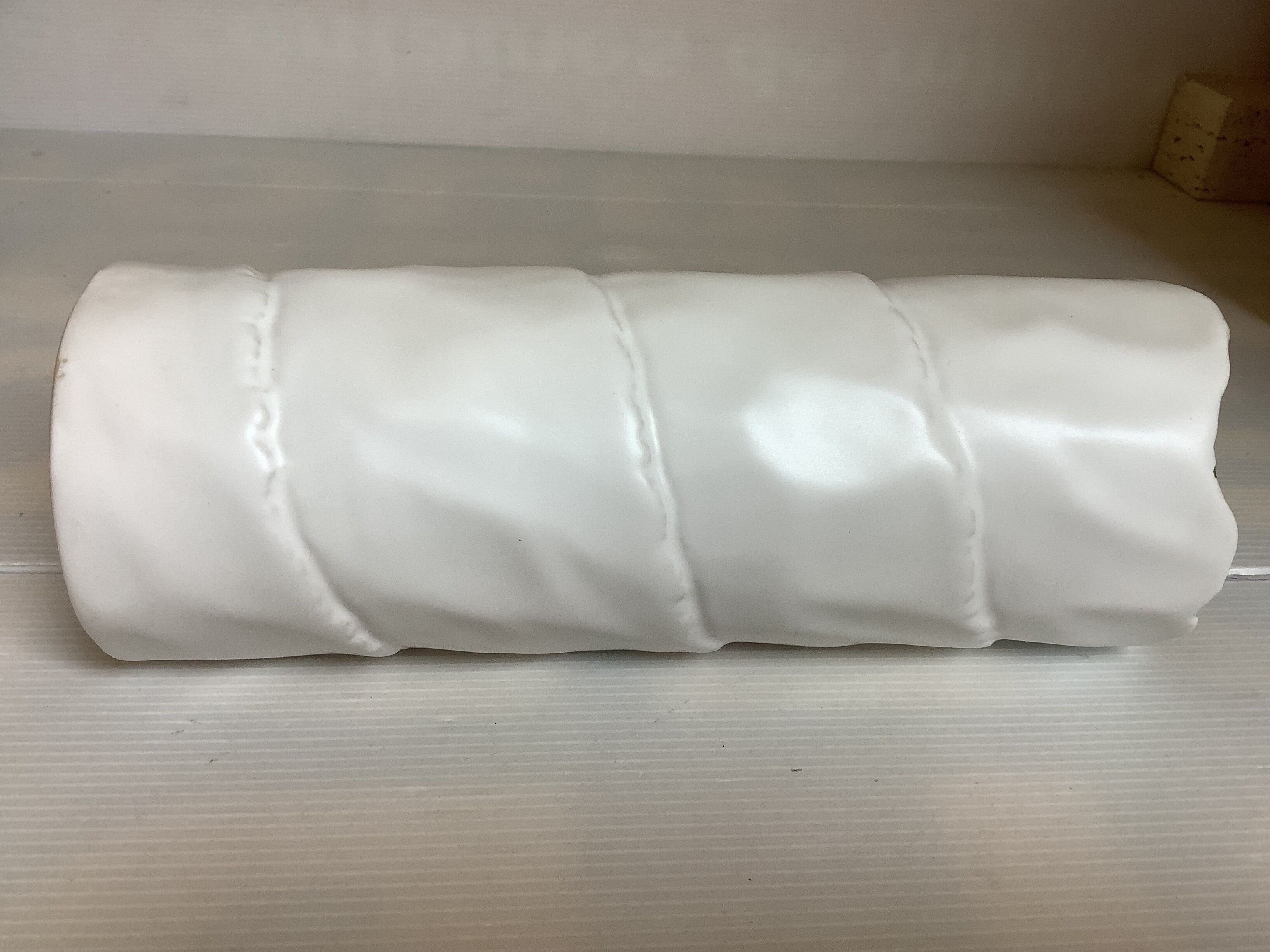 Vase with patterns of rolled paper leaves