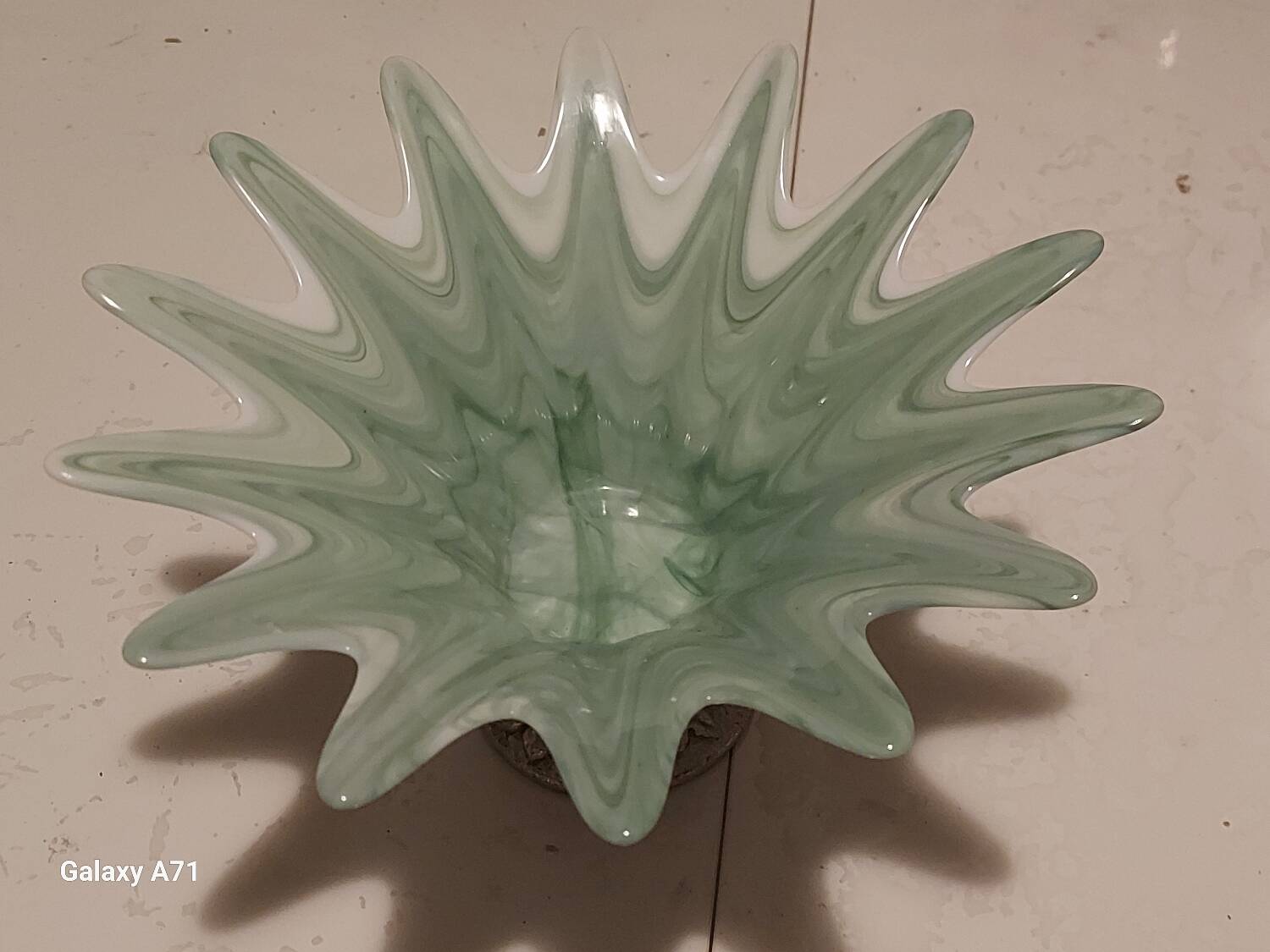 Opalescent glass bowl in the Murano style with a silver-plated metal base.