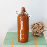 Bouteille ancienne en grès vernissé à bouchon en faïence