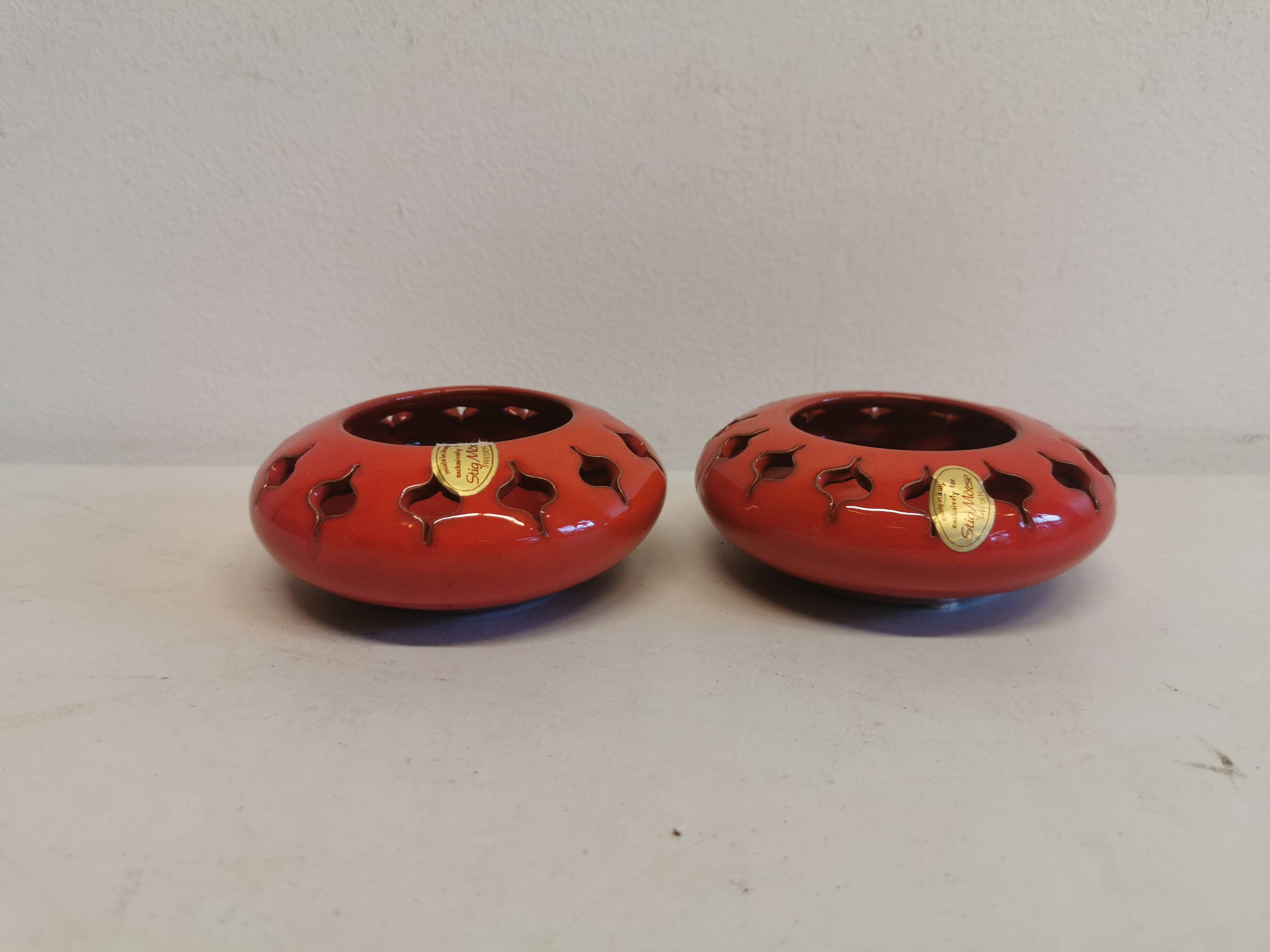 Pair of candle holders from the 1960s-1970s, crafted in red ceramic